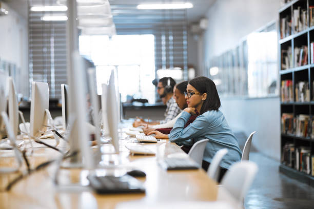istockphoto-862661268-612×612 Shot of a group of university students working on computers in the library at campus